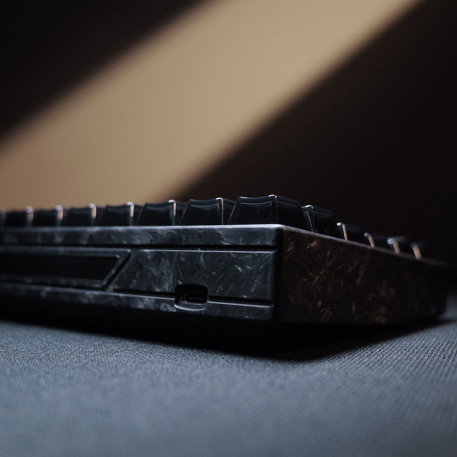 YING75 Forged Carbon Fiber Keyboard close-up, showcasing sleek design and unique texture, perfect for gamers and productivity enthusiasts.