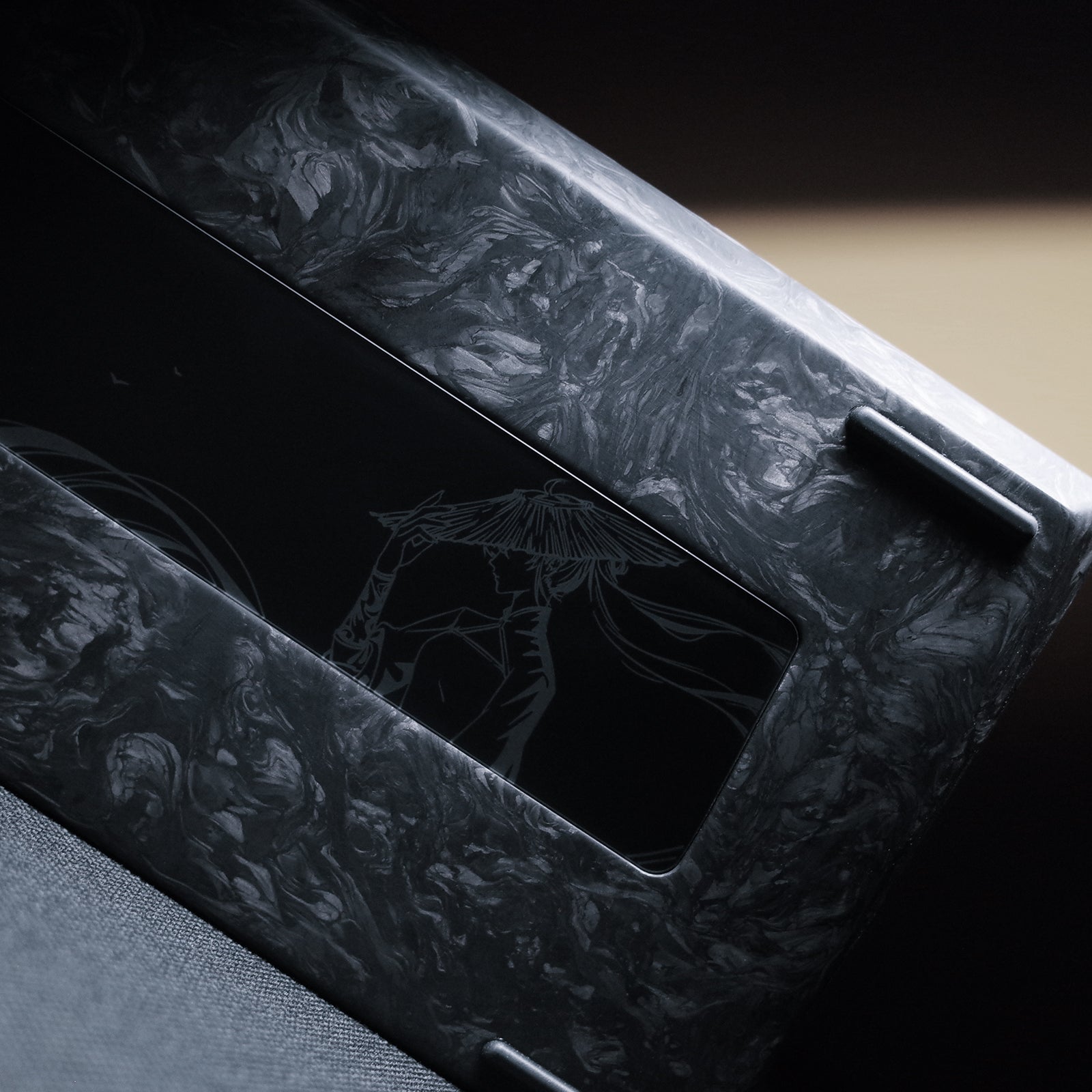 Close-up of the YING75 Forged Carbon Fiber Keyboard showcasing its intricate design and texture.