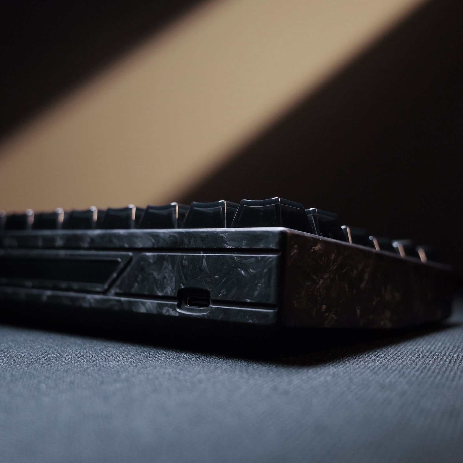 YING75 Forged Carbon Fiber Keyboard close-up, showcasing sleek design and unique texture, perfect for gamers and productivity enthusiasts.