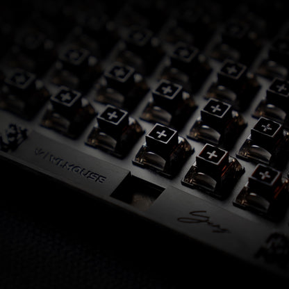 YING75 Forged Carbon Fiber Keyboard close-up showing key switches and WLMOUSE branding, highlighting its sleek design.